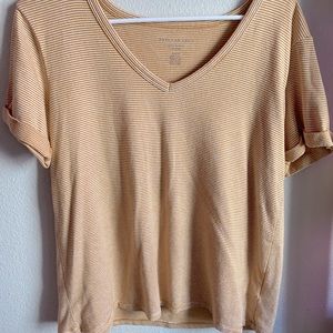 Burnt yellow and white striped American Eagle tee!